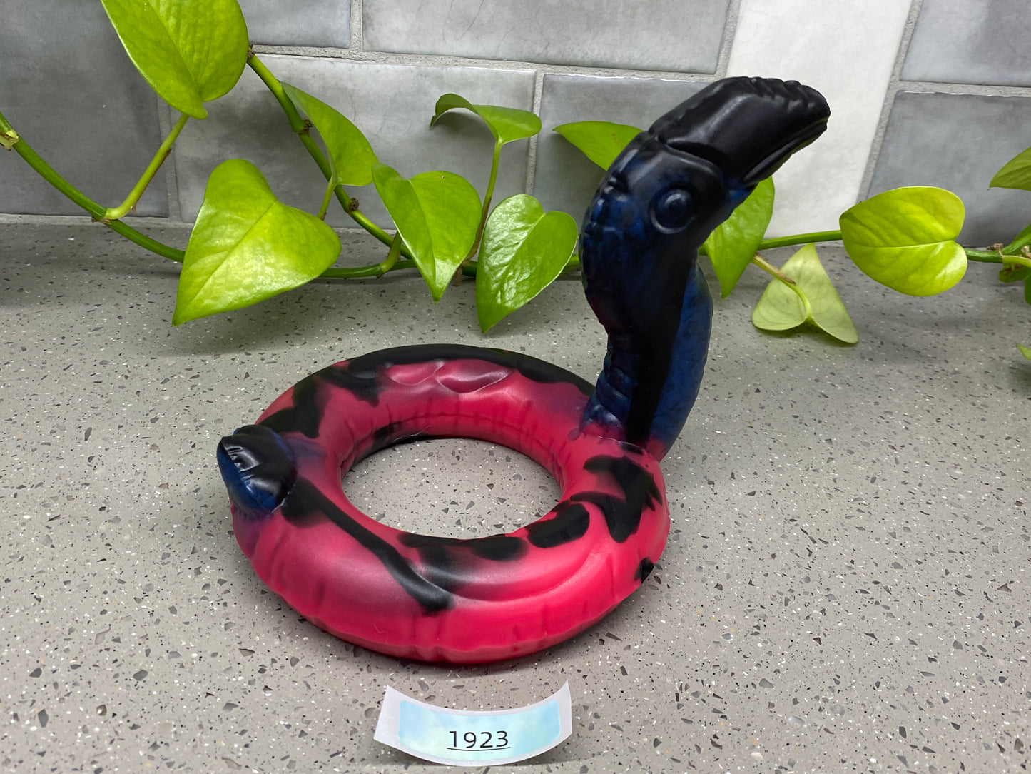 a red and black object sitting on top of a table