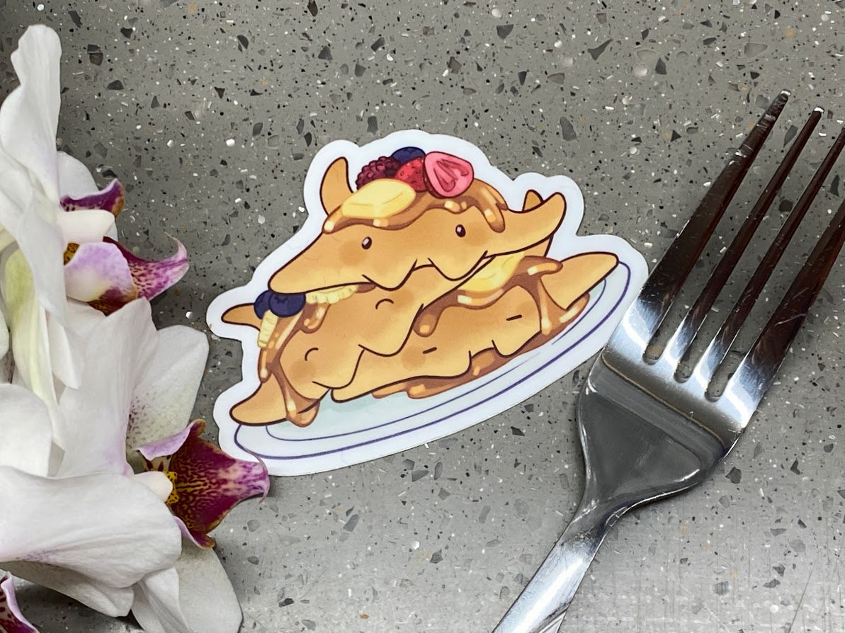 a fork and a sticker on a table