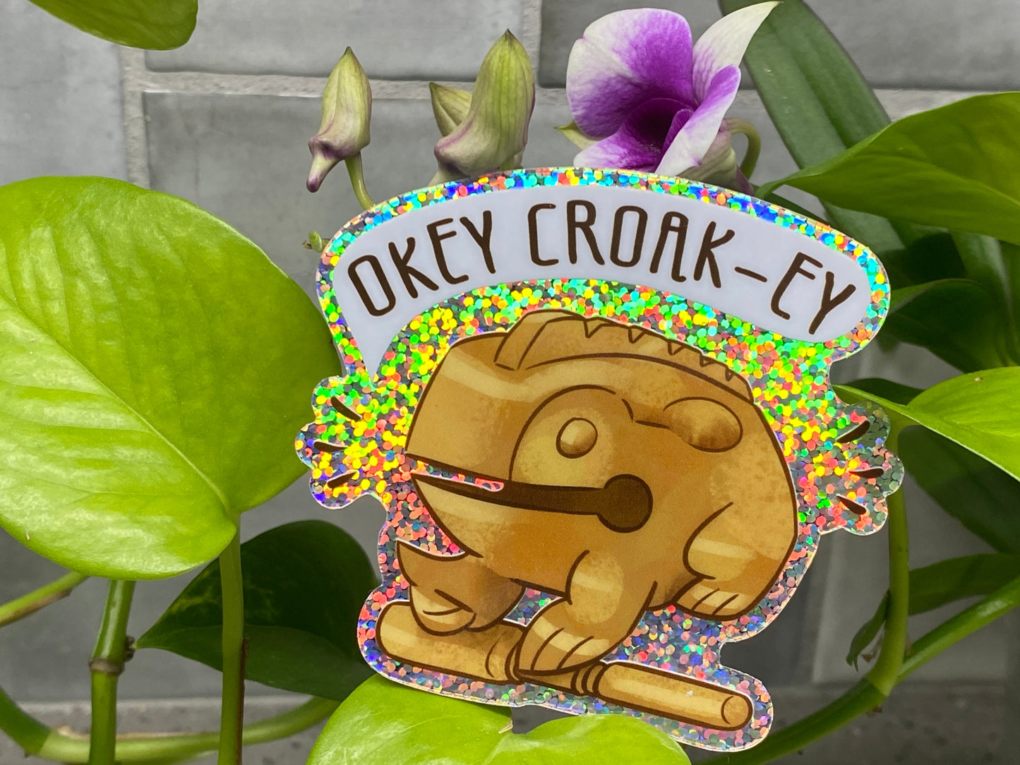a close up of a plant with a sign on it