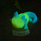 a glowing toy of a lizard on a table