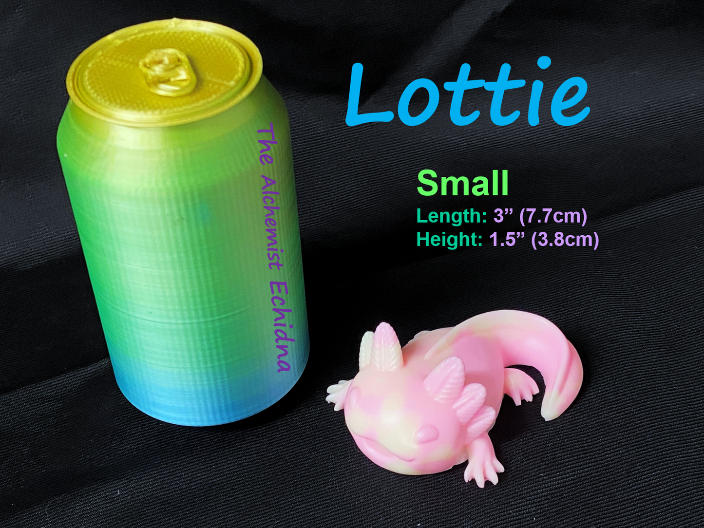 a small toy gecko next to a can of soda