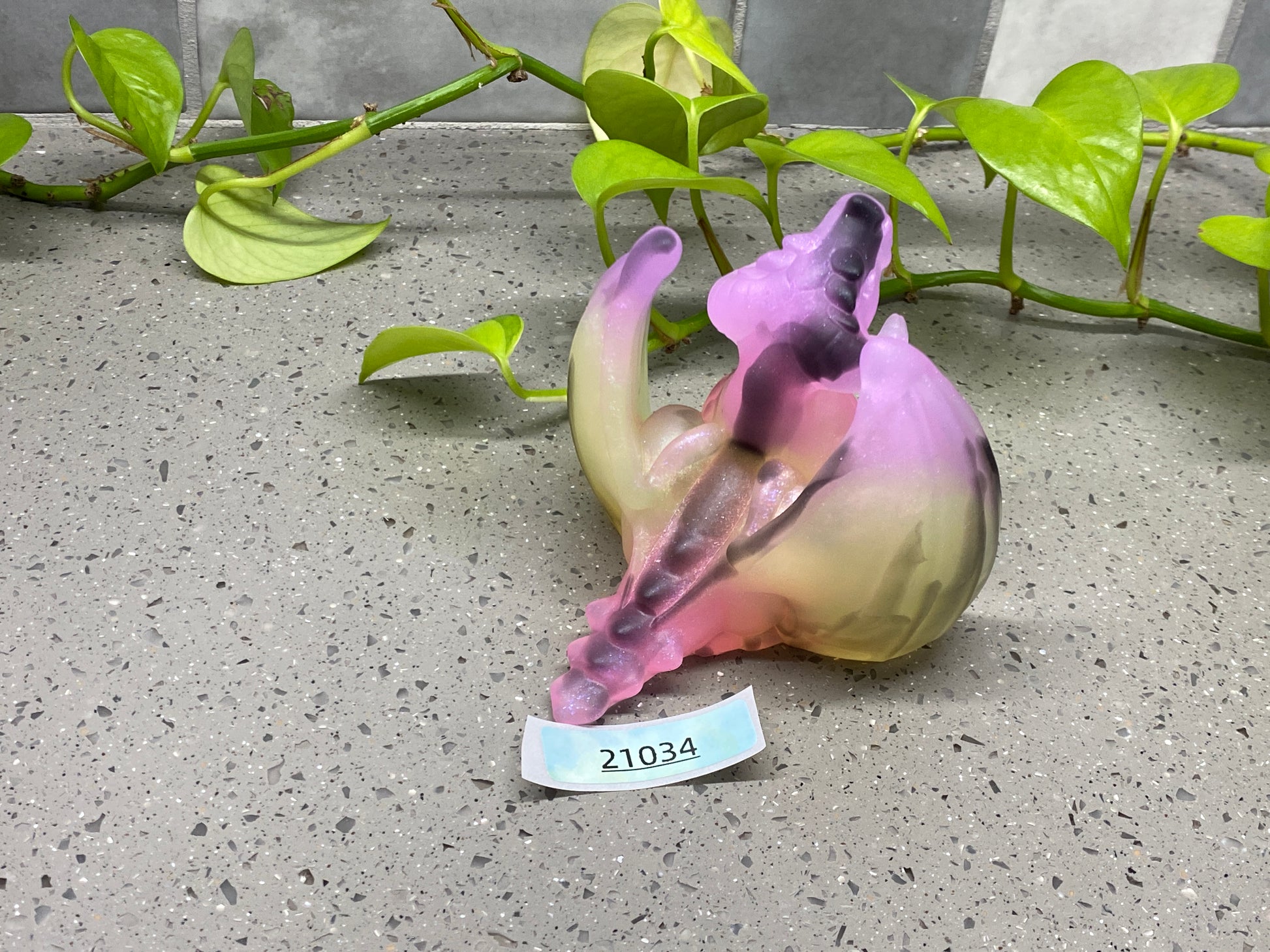 a ceramic figurine of a fish on a table