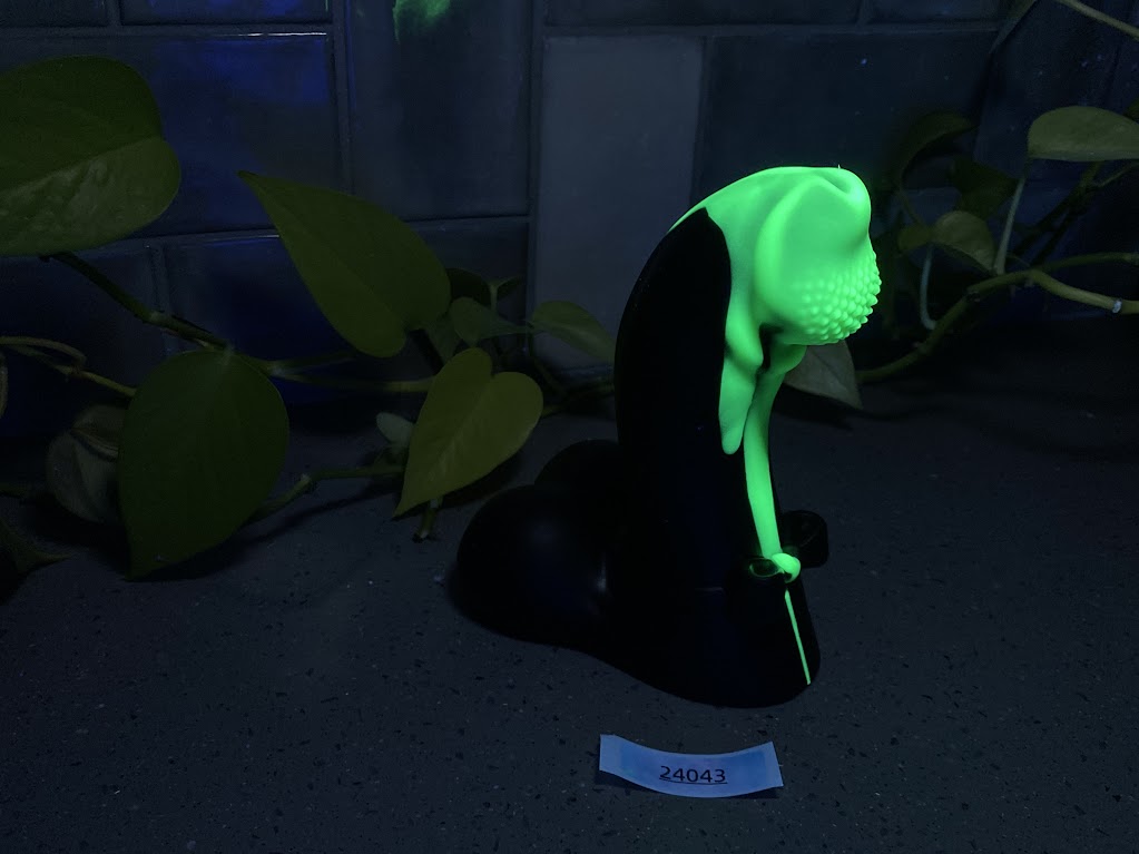 a green light on top of a black object