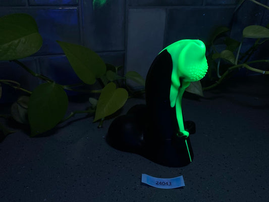 a green light on top of a black object