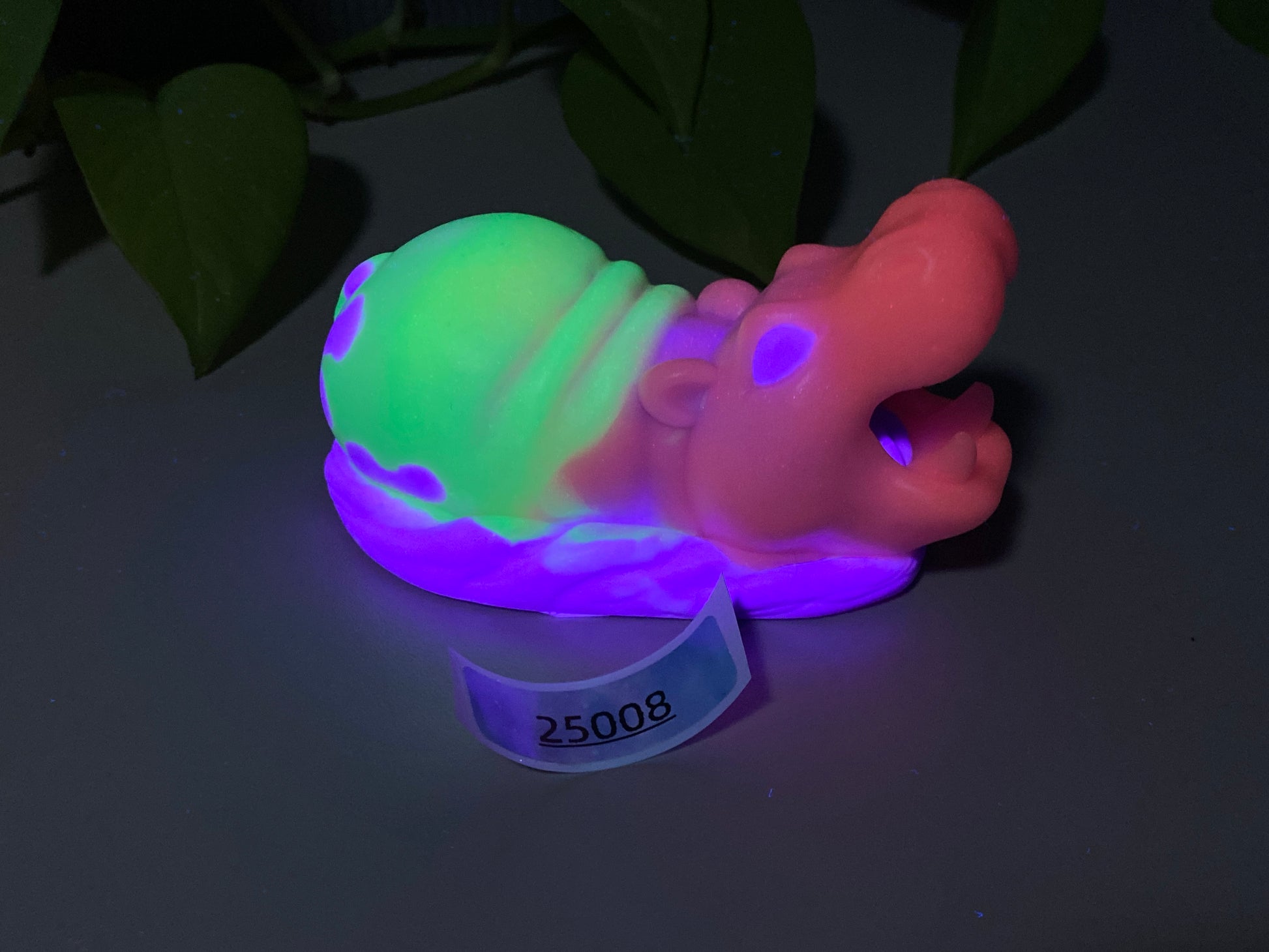 a plastic toy with a neon glow on it