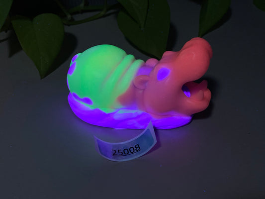 a plastic toy with a neon glow on it