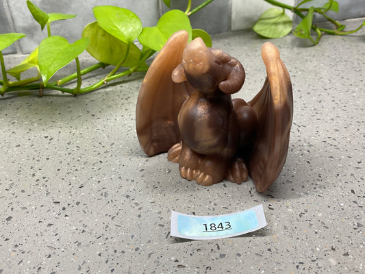 a small figurine of a squirrel on a table