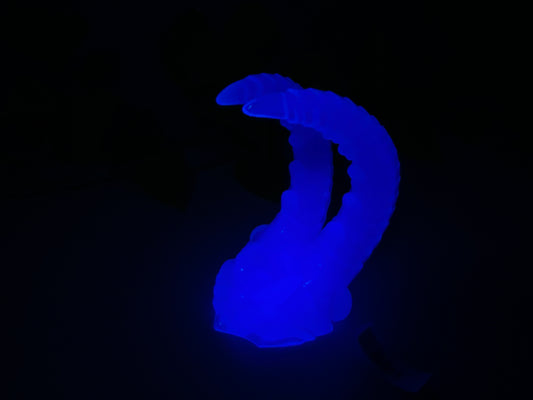 a blue object is glowing in the dark