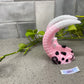 a pink and black object sitting on top of a counter