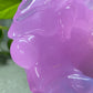 a close up of a purple bear statue