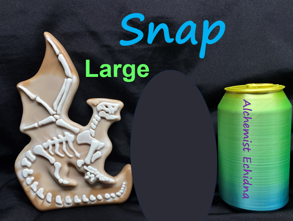 a cookie shaped like a dinosaur next to a can of soda