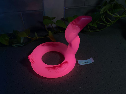 a pink object sitting on top of a table