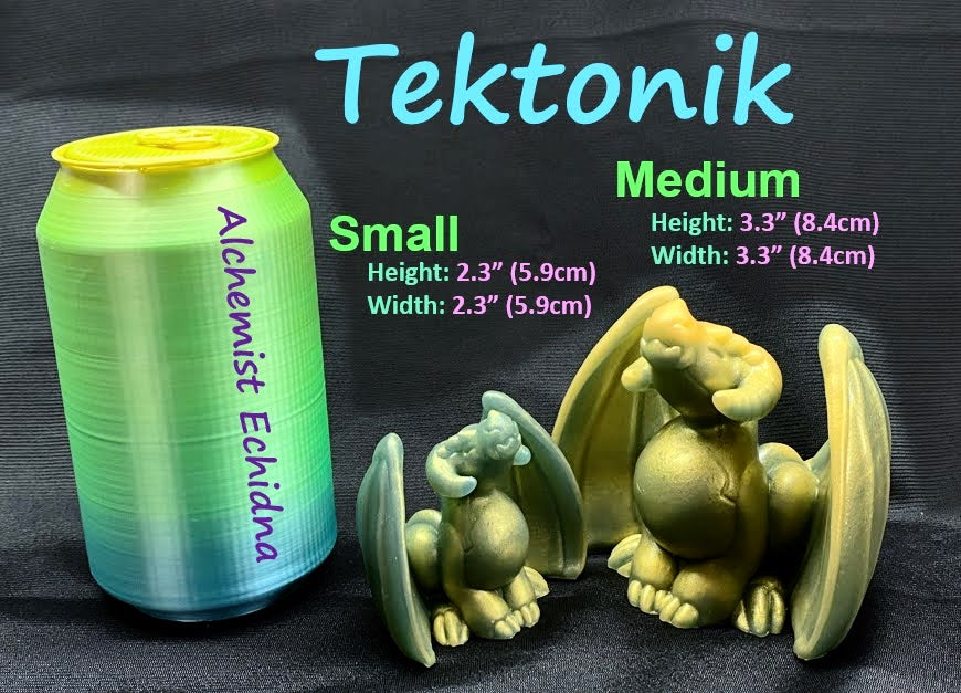 a can of soda next to a small figurine of a dragon