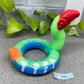 an inflatable ring with a red bird on top of it
