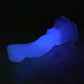 a person laying down in the dark with a glowing object