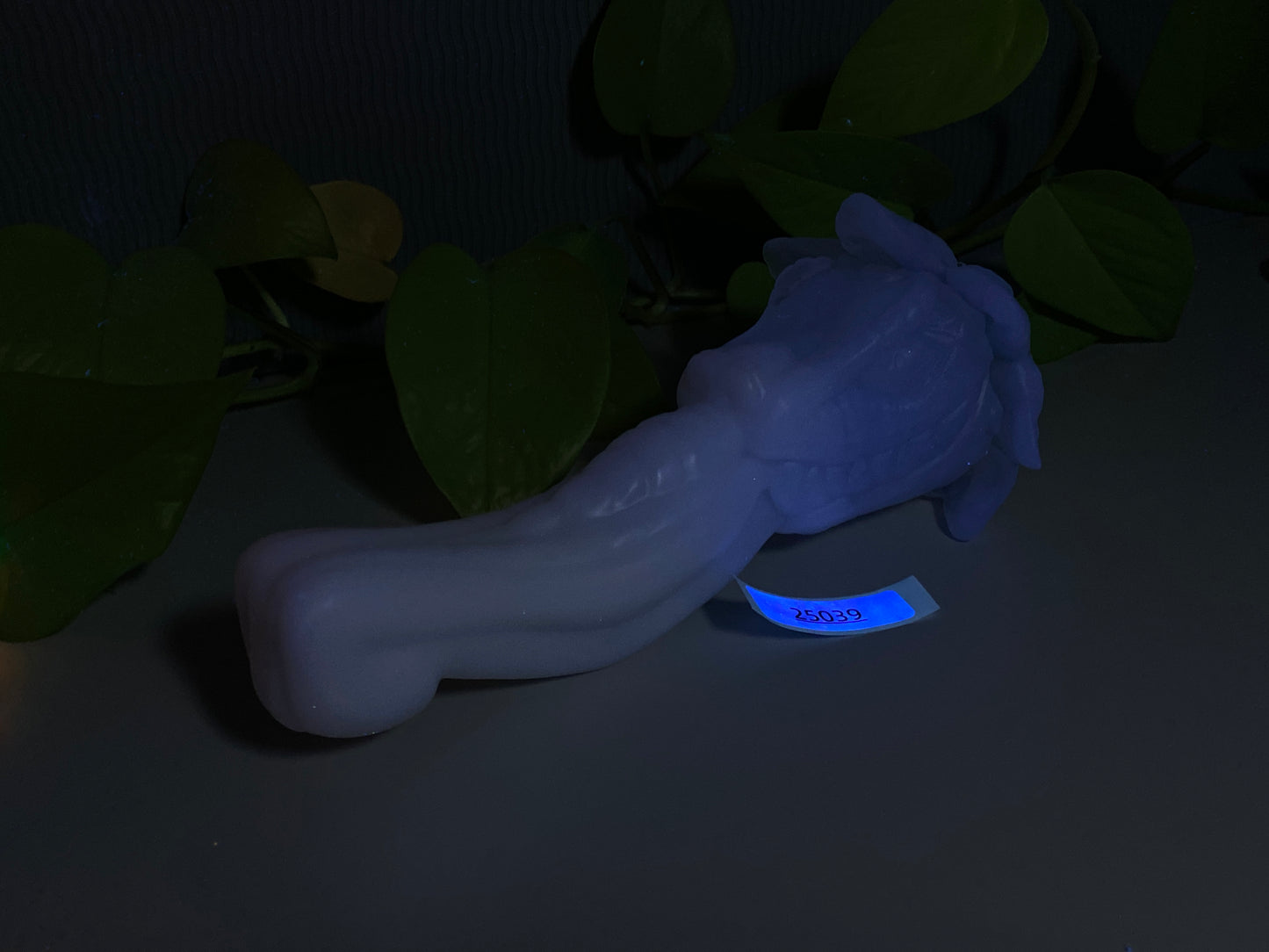 a blue light is shining on a white object