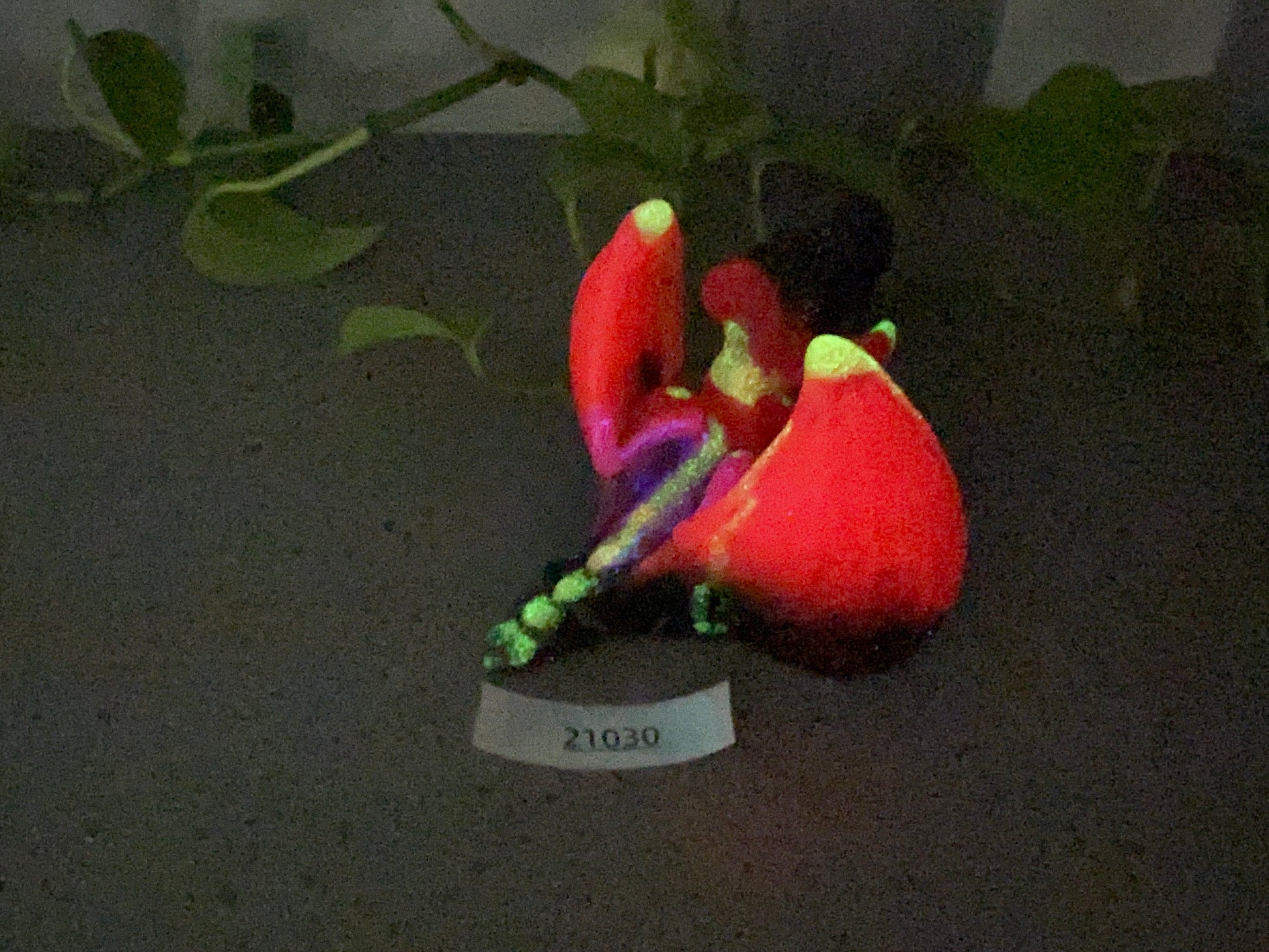 a small figurine of a person sitting on a table