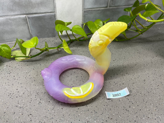 a purple and yellow ring with a lemon slice on it