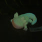 a glow in the dark toy of a gecko