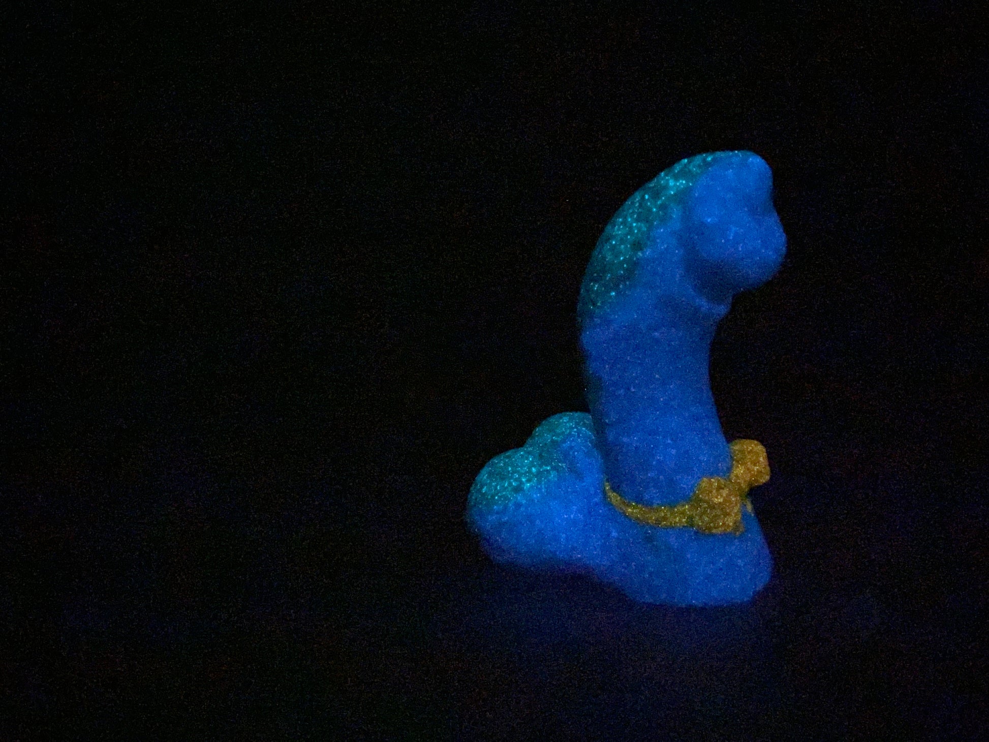 a small blue object sitting on top of a table