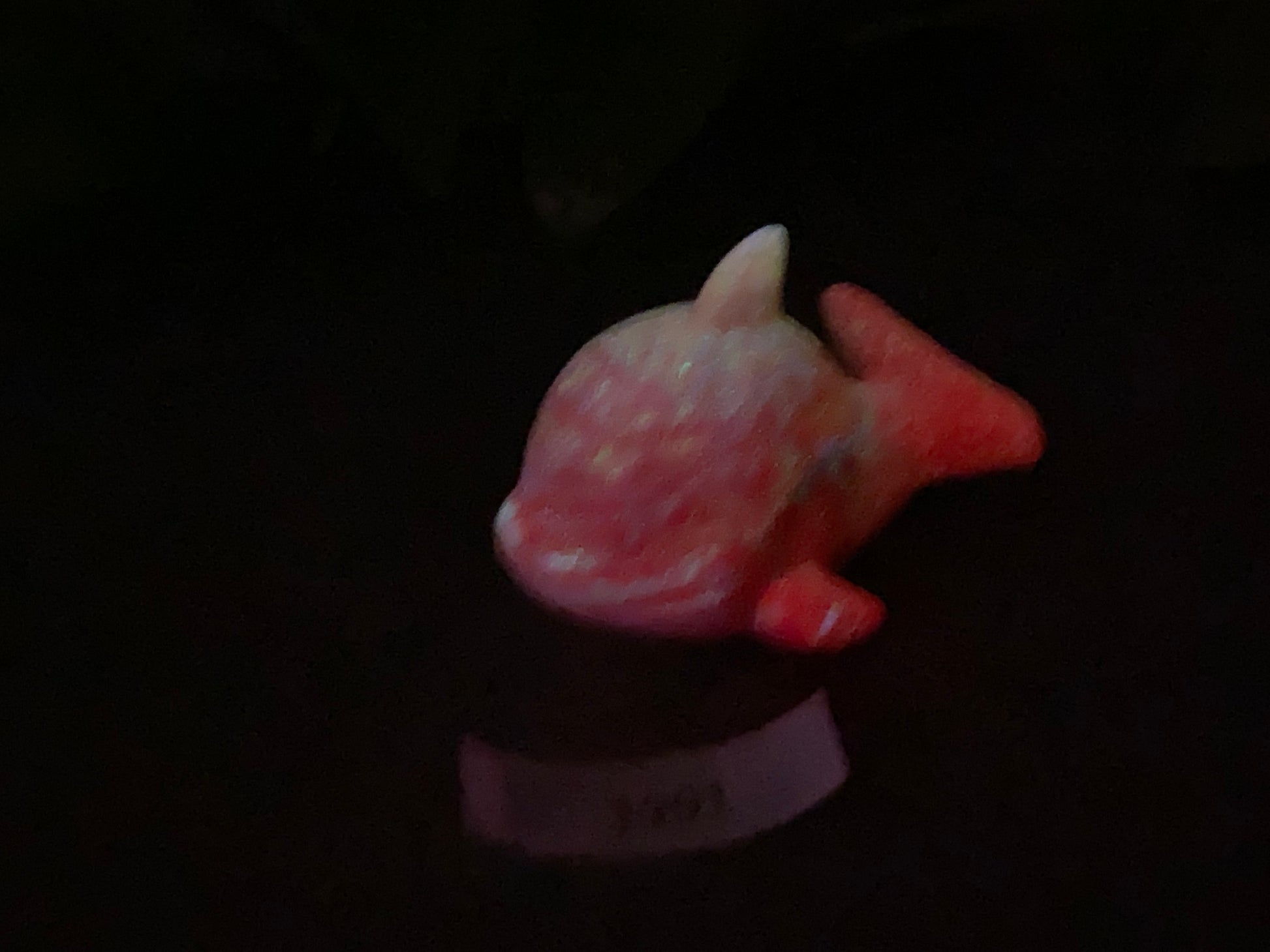 a close up of a small figurine of a fish