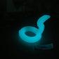 a glow ring sitting on a table in the dark