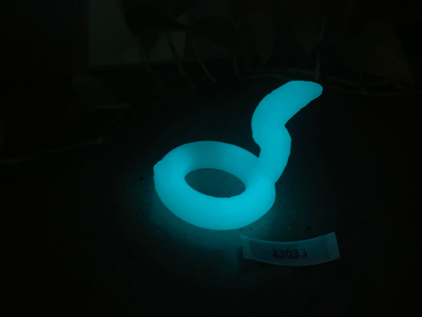 a glow ring sitting on a table in the dark