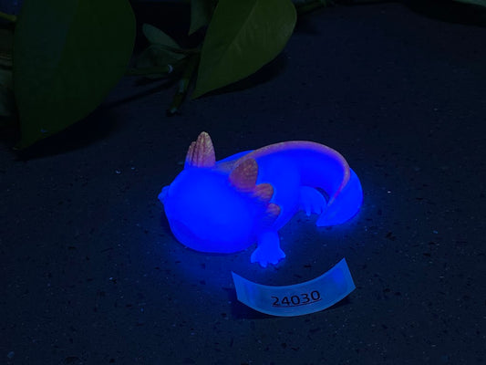 a blue light up toy laying on top of a table