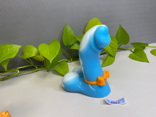 a blue toy sitting on top of a white table