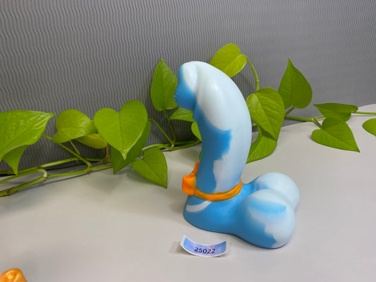 a blue and white object sitting on top of a table