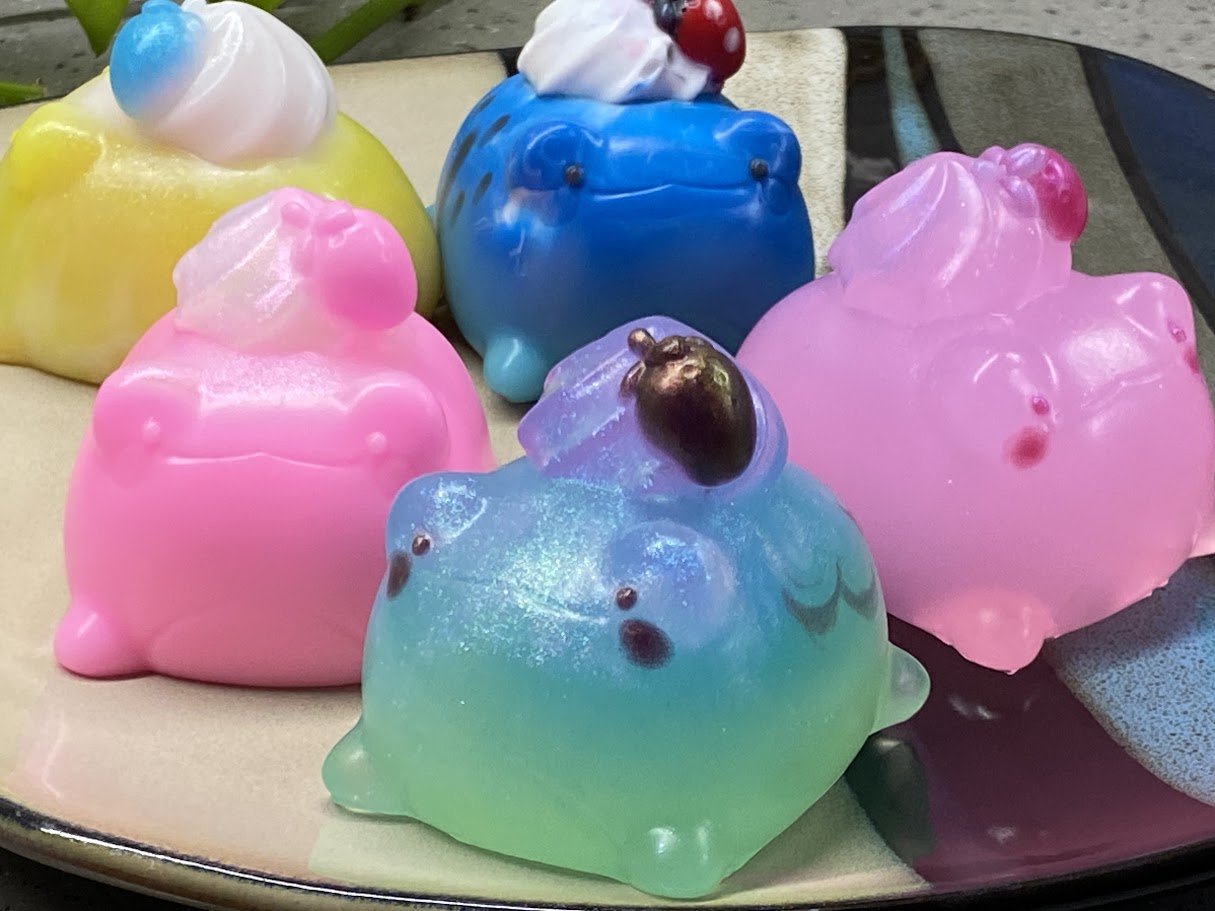 a group of soaps sitting on top of a plate