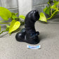 a black bear figurine sitting on top of a table