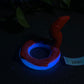 a red and blue ring sitting on top of a table