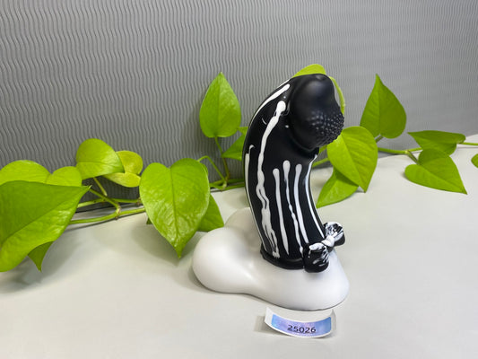 a black and white object sitting on top of a white table