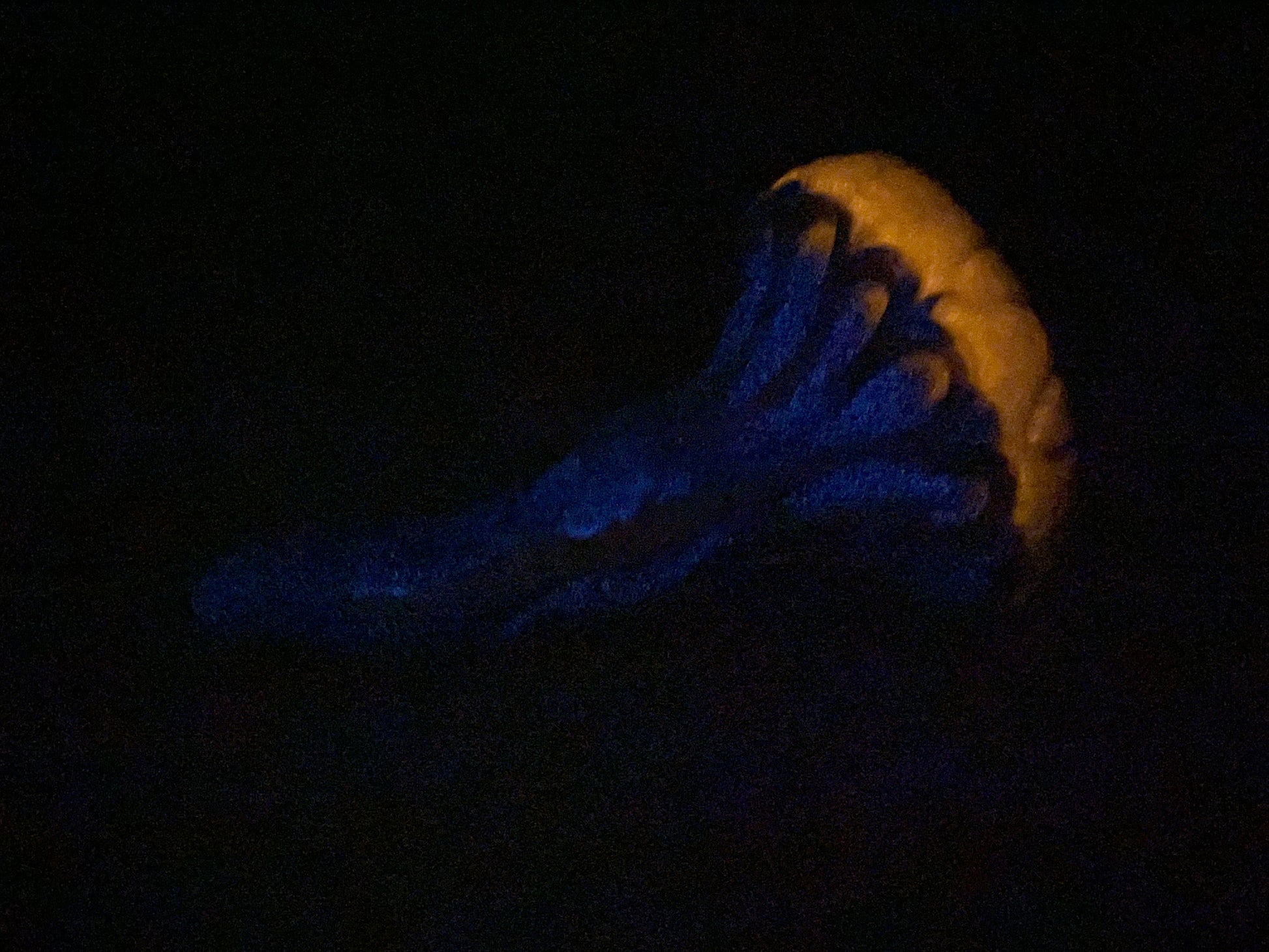 a banana sitting on top of a black table