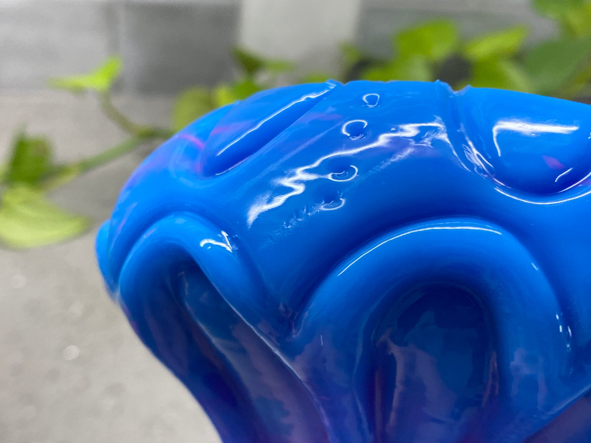 a blue vase sitting on top of a table