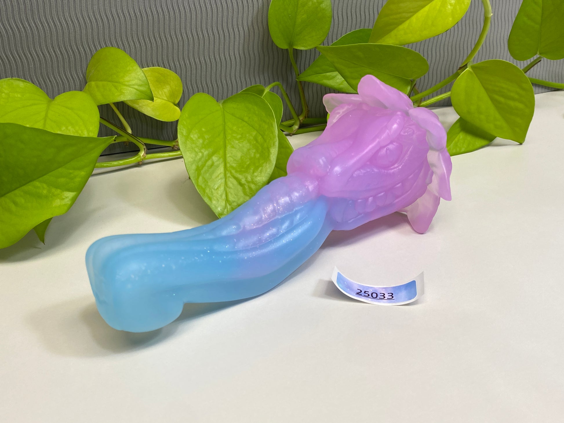 a purple and blue toothbrush sitting on top of a table