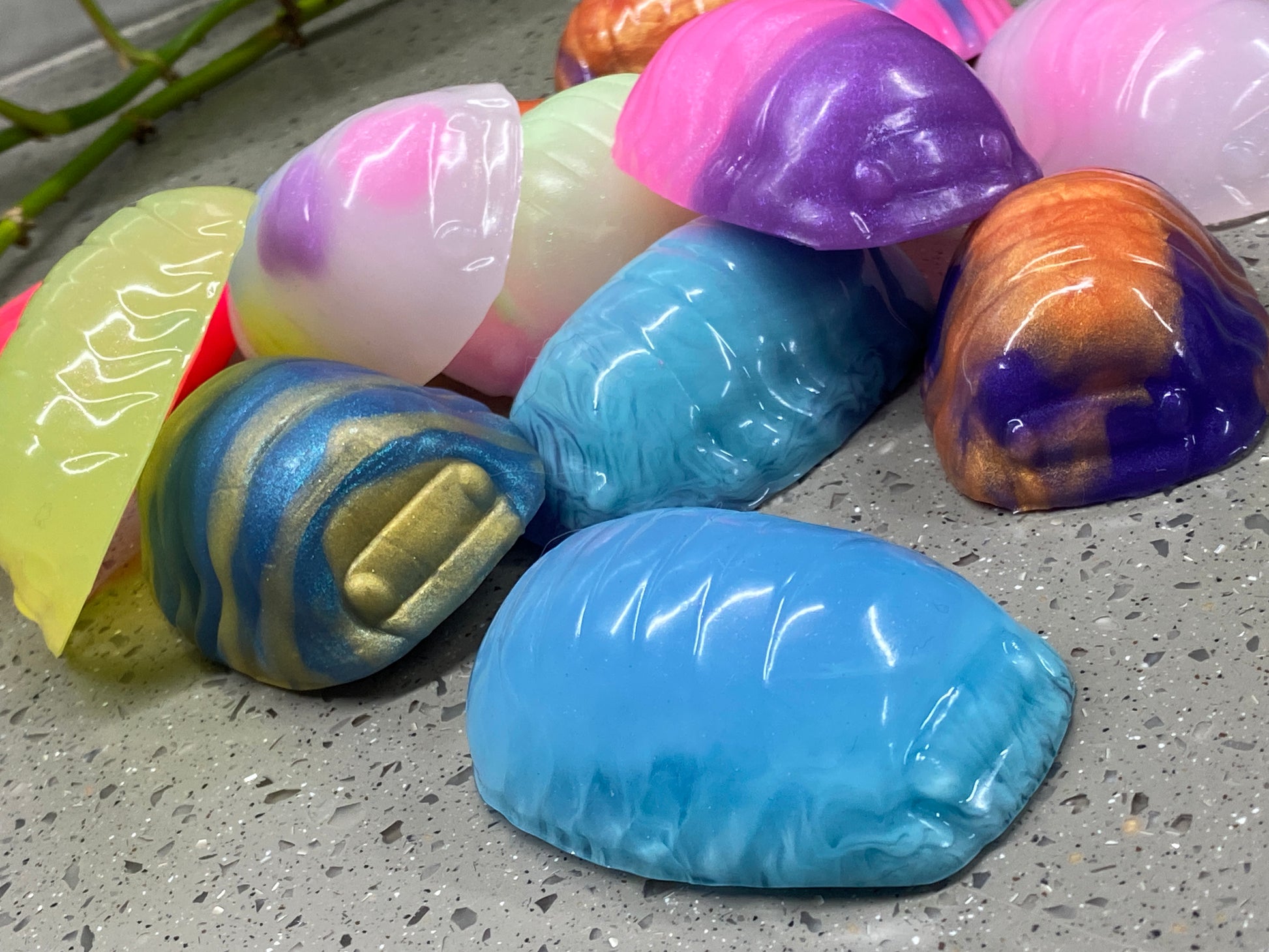 a bunch of colorful balloons sitting on the ground