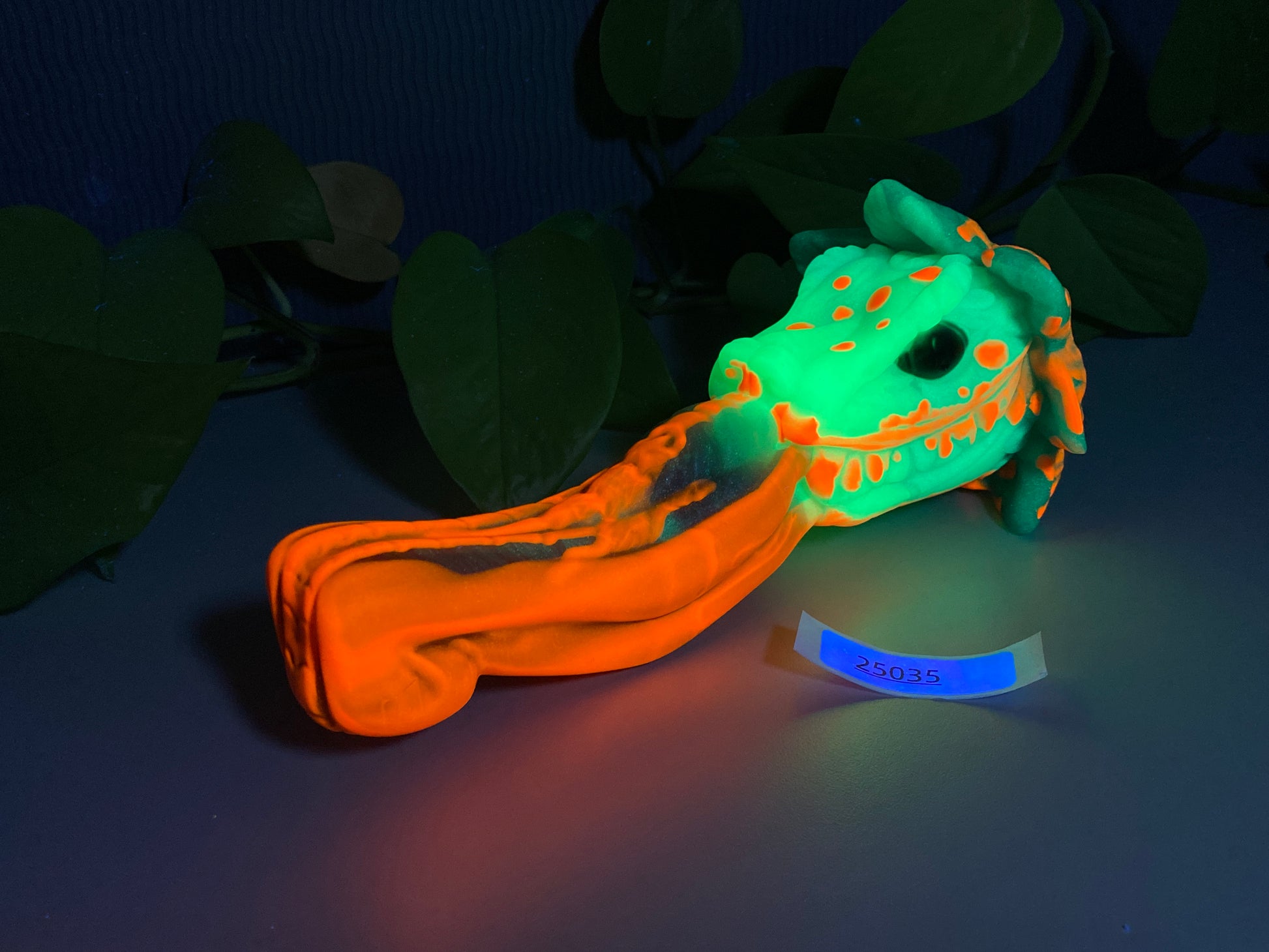 a glow in the dark toy laying on top of a table