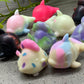 a group of small toy animals sitting next to each other