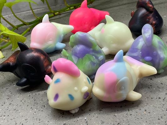 a group of small toy animals sitting next to each other