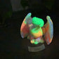 a glow stuffed animal sitting on top of a table