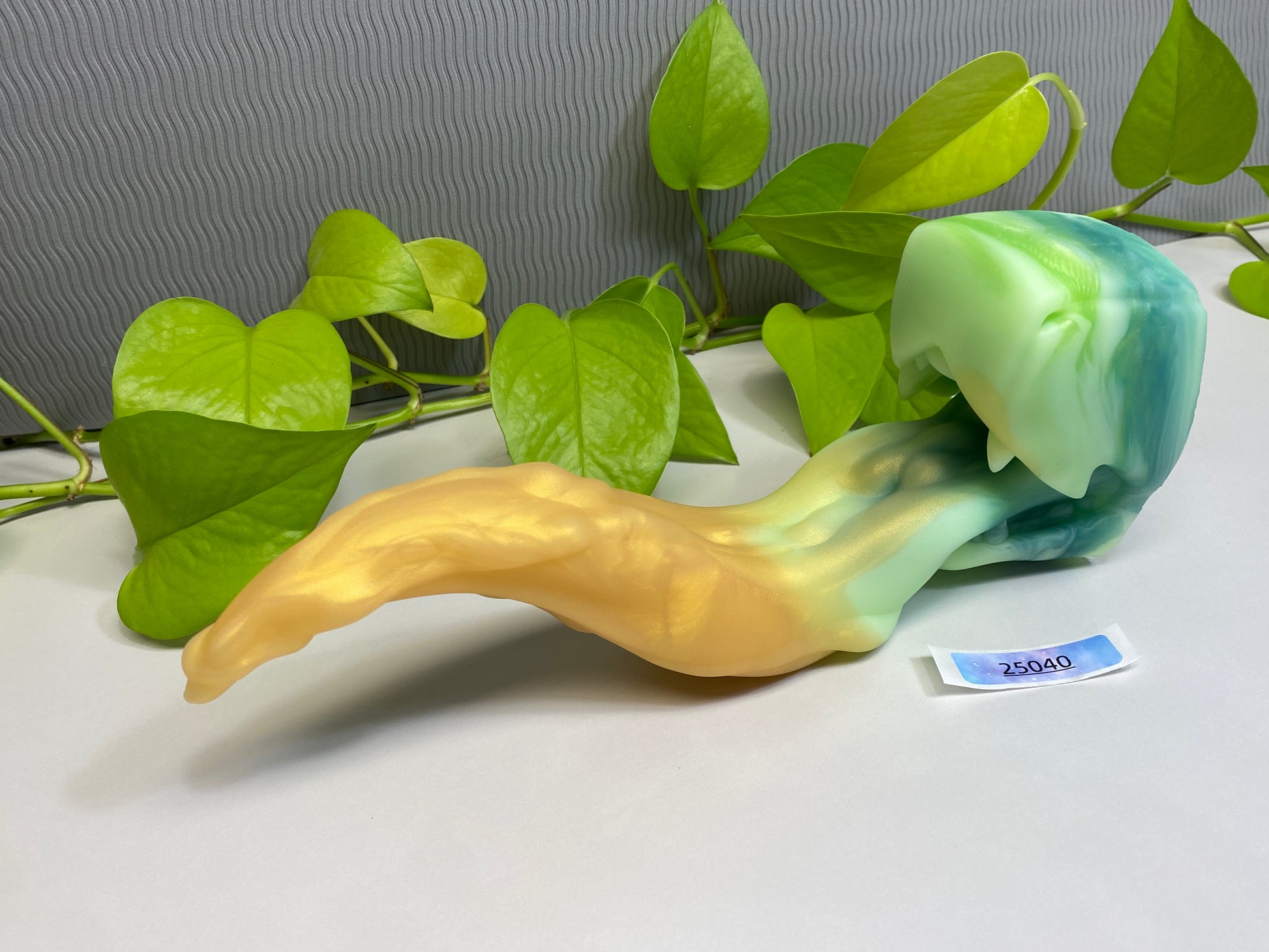 a green and yellow object sitting on top of a table