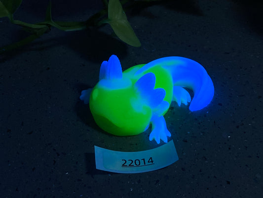 a glowing toy lizard sitting on top of a table