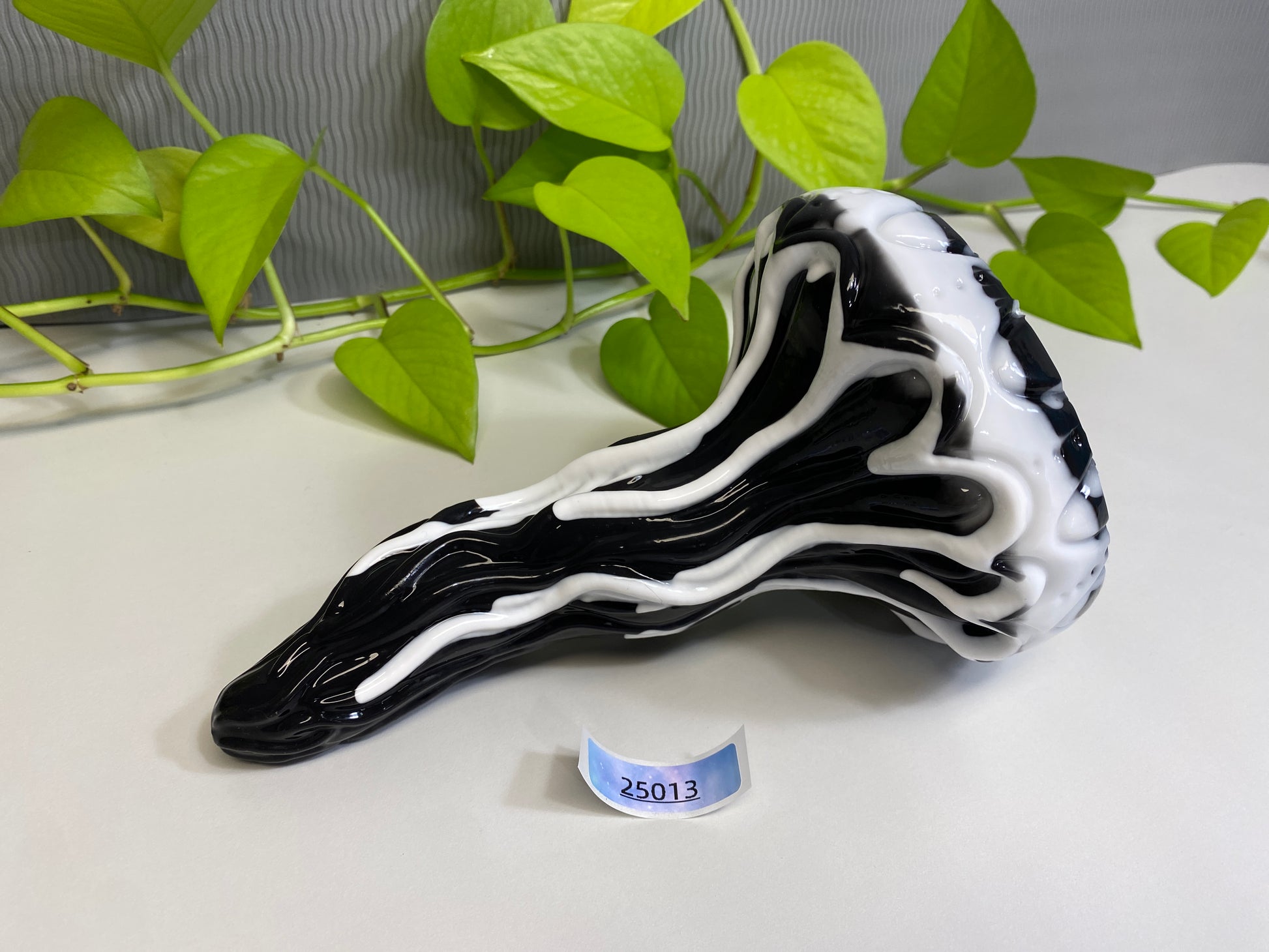 a black and white vase sitting on top of a table