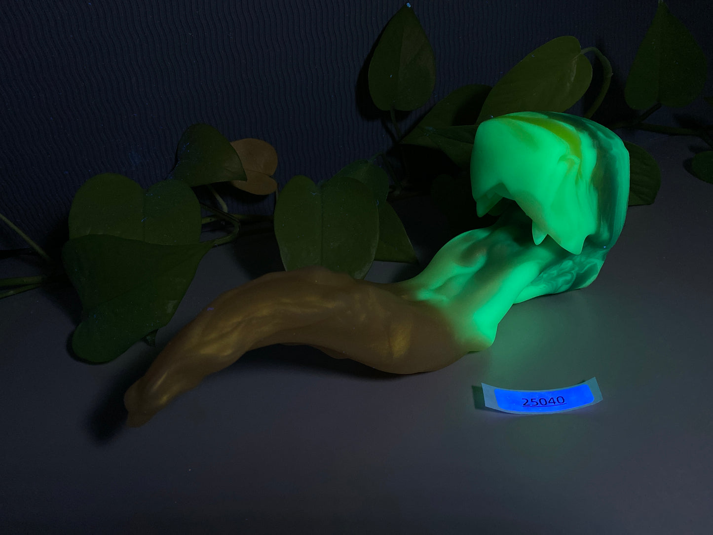 a glow in the dark toy of a banana and some leaves