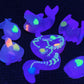 glow in the dark sea creatures on a black background