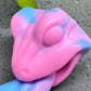 a close up of a pink and blue toy
