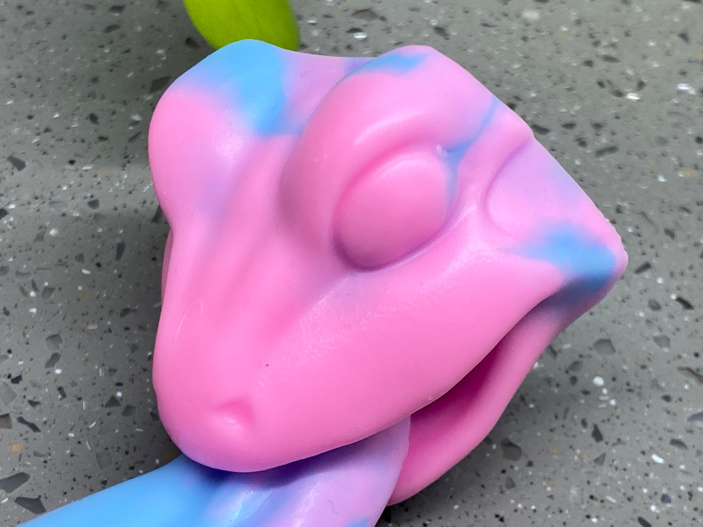 a close up of a pink and blue toy