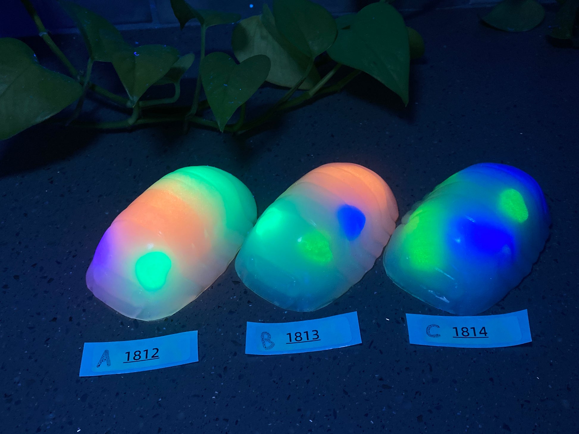 a group of three glowing eggs sitting on top of a table